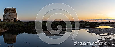 Panorama view of old windmill ruins and tidal pools on the coast of Murcia at sunset Stock Photo