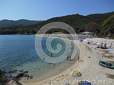 Panorama view of sandy beach Ammos, near Olympiada, Greece and bright clear blue sea Editorial Stock Photo