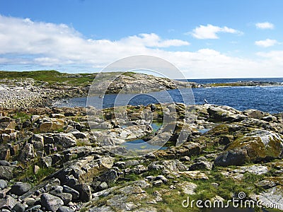 A panorama view of a sea shore with stones Stock Photo