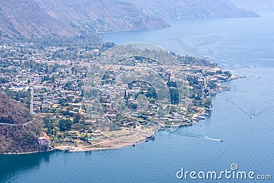 Panorama view to the village Panajachel at the lake Atitlan with amazing volcanos - Guatemala Stock Photo