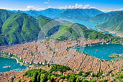 Panoramic aerial view of the city of Como facing the famous Lake Como and the surrounding mountains made Stock Photo