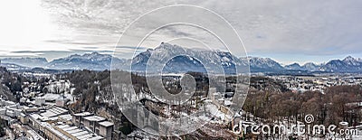 Panoramic aerial view of Mochsberg top with view of Untersberg snow mountain in Salzburg winter Stock Photo