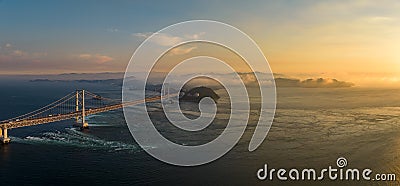 Panoramic aerial view of Naruto Bridge and whirlpools at sunset Stock Photo