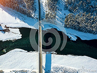 Panoramic aerial view nature and picturesque landscape near a Altay mountain with a green river Katun and bridge on a winter sunny Stock Photo