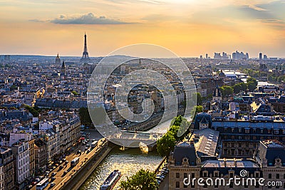 Panoramic aerial view of Paris, Eiffel Tower and La Defense business district. Aerial view of Paris at sunset. Panoramic view of Stock Photo