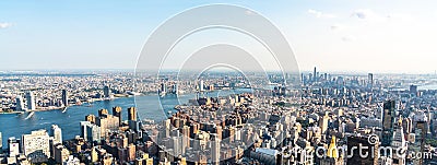 Panoramic aerial view of the rooftops of skyscrapers and districts of central Manhattan as well as the streets of a Stock Photo