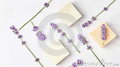 Panoramic banner. pattern of lavender flowers and bars of natural soap on a marble background. flat lay, top view Stock Photo