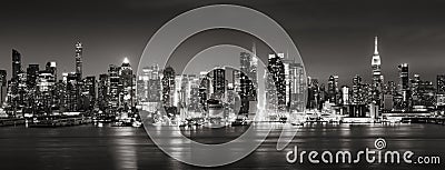 Panoramic Black & White view of Midtown West skyscrapers at night. Manhattan, New York City Stock Photo