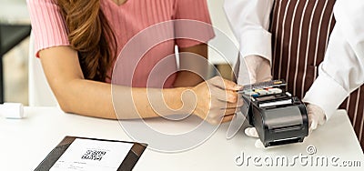 Panoramic Close up Asian woman customer make contactless credit card payment Stock Photo