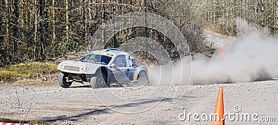 Panoramic closeup shot of a Trophy truck flat out on a dusty track at Walters arena, United Kingdom Editorial Stock Photo