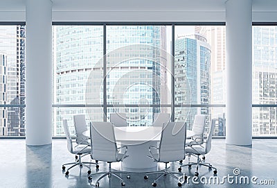 Panoramic conference room in modern office, Moscow International Business Center view. White chairs and a white round table. Stock Photo