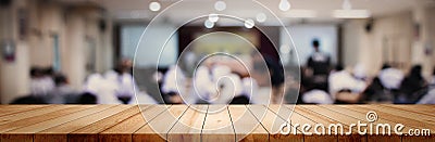 Panoramic empty clean wood counter table top on blur student study in classroom white light background for product education Stock Photo