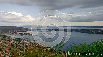 Panoramic image of the bay with tiled roofs, picturesque mountains and the bay. Croatia. Stock Photo
