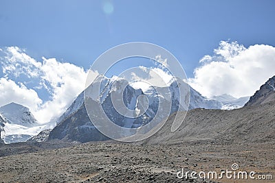 Panoramic landscape view of snowcapped great Himalayas mountains seen from Gurudongmar Lake, a famous tourist attraction in Mangan Stock Photo