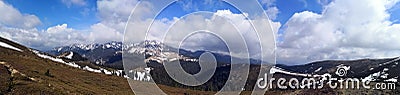 Panoramic mountains landscape in early spring - panoramic view Stock Photo