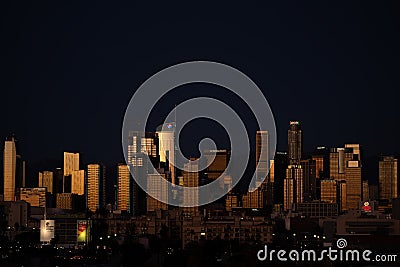 Panoramic night view of City of Los Angeles with highrises reflecting evening light Stock Photo