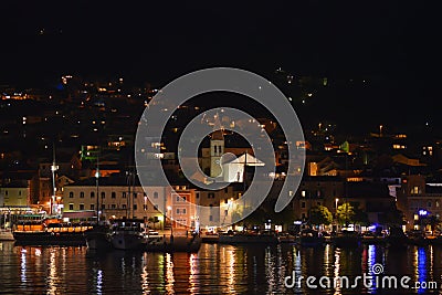 Panoramic night view of Makarska city center from the sea in Makarska, Croatia on June 16, 2019. Editorial Stock Photo