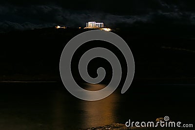 Panoramic night view of the remains of a Greek temple dedicated to Poseidon, on the cape of Cape Sunio, located on the southern Stock Photo