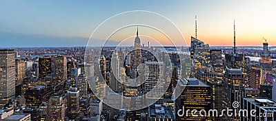 Panoramic photo of New York City Skyline in Manhattan downtown with Empire State Building and skyscrapers at night USA Stock Photo