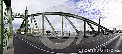 Panoramic photograph of the interior of the Budapest Freedom Bridge, with its cast iron structure and decorated towers Editorial Stock Photo