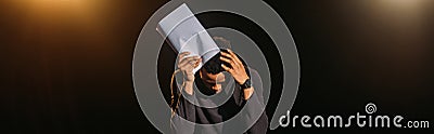 Emotional african american actor holding scenario Stock Photo