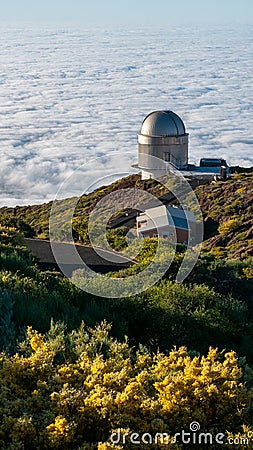 Panoramic shot of the La Palma astronomical observatory on the sea of clouds background Stock Photo