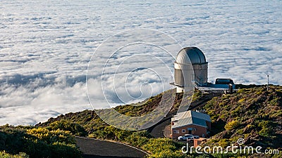 Panoramic shot of the La Palma astronomical observatory on the sea of clouds background Stock Photo