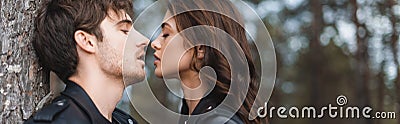 Panoramic shot of man kissing brunette Stock Photo