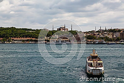 Panoramic shot of the old town Istanbul; The Hagia Sophia Ayasofya Mosque Eminonu, ferries and boats on the Golden Horn, Editorial Stock Photo