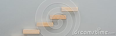 Panoramic shot of wooden blocks symbolizing career ladder isolated on grey. Stock Photo