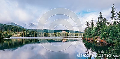 Panoramic spectacular view to Strbske Pleso in High Tatras - a mountain lake at 1350m. Popular trekking routes, ski resort, and Stock Photo