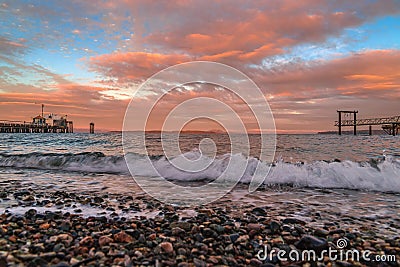 Sunset Clouds Over Ocean Waves In British Columbia Stock Photo