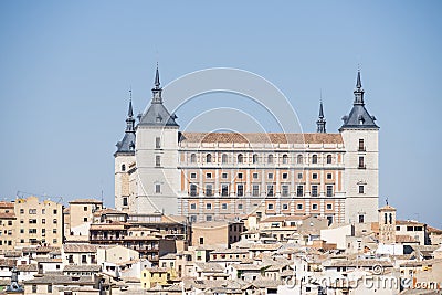 panoramic view of the Alcazar of Toledo and part of the surrounding houses one sunny and torrid afternoon Stock Photo
