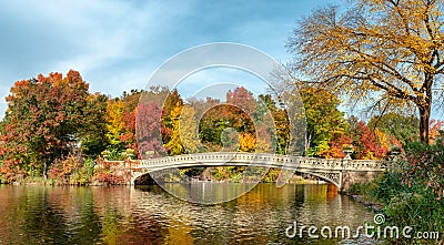 Panoramic view of autumn landscape with Bow bridge in Central Park. New York City. USA Stock Photo