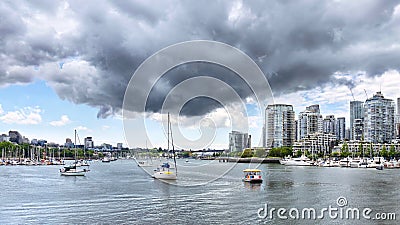 Beautiful Vancouver downtown. Yacht in False Creek and stormy clouds, British Columbia Canada Stock Photo