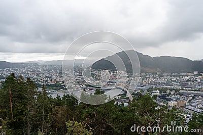 Panoramic view of Bergen from Floyen Mountain in August 2019. Trees in front of the city Stock Photo