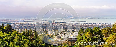Panoramic view of Berkeley; San Francisco Bay shoreline with Port of Oakland, Yerba Buena Island, Treasure Island, the Bay bridge Editorial Stock Photo