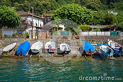 Scenic view of speed boats in Brusino Arsizio on the shore of Lake Lugano, in Switzerland. Editorial Stock Photo