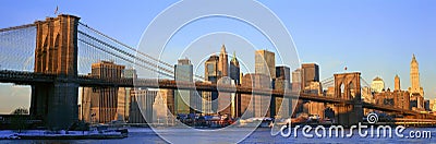 Panoramic view of Brooklyn Bridge and East River at sunrise with New York City, NY skyline post 9/11 view Editorial Stock Photo