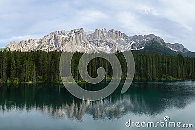 Panoramic view of Carezza Lake with reflecting in the water mount Latemar, Italy Stock Photo