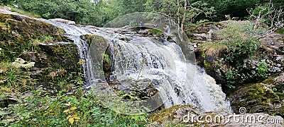 Panoramic view of the cascading and splashing water of the Aira falls Stock Photo