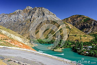 Panoramic view of Charvak Lake, a huge artificial lake-reservoir created by erecting a high stone dam on the Chirchiq River Stock Photo