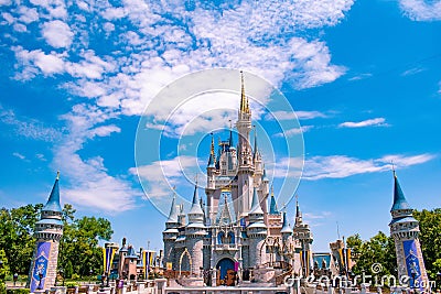 Panoramic view of Cinderella`s Castle on cloudy lightblue sky background in Magic Kingdom at Walt Disney World Resort 2 Editorial Stock Photo