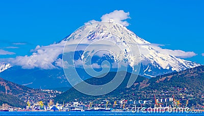 Panoramic view of the city Petropavlovsk-Kamchatsky and volcanoes: Koryaksky Volcano, Avacha Volcano, Kozelsky Volcano. Russian Stock Photo