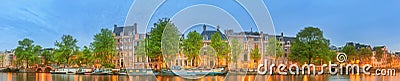 Panoramic view and cityscape of Amsterdam with boats, old buildings and Amstel river, Holland, Netherlands Stock Photo