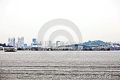 Panoramic view of the coastline of the city of Singapore from the sea and the strait. Stock Photo