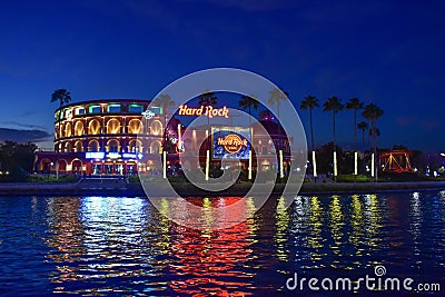 Panoramic view of colorful and illuminated Hard Rock Cafe on blue night background at Universal Studios area. Editorial Stock Photo