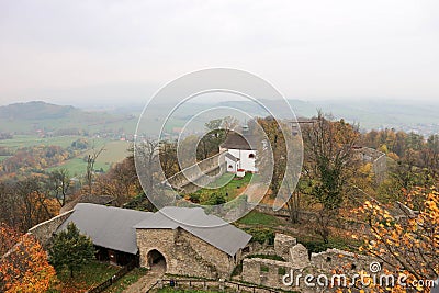 Panoramic view of courtyard of Hukvaldy medieval castle with colorful autumn forest and mountains on the background Stock Photo