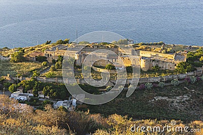 Mediterranean ancient castle on mountain above the sea. Stock Photo