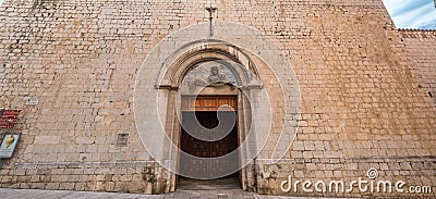Panoramic view of facade and main entrance of Saint Peter church (Esglesia de Sant Pere) Romanesque Style Catholic church Editorial Stock Photo